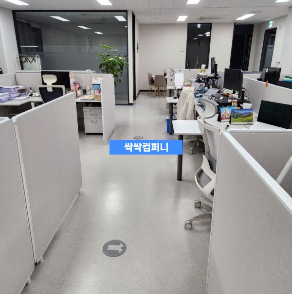 an office with cubicles and desks