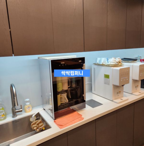 a kitchen counter with a microwave and a sink